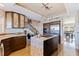 Spacious kitchen with island, stainless steel appliances, and hardwood floors at 127 Sands Point Dr, Tierra Verde, FL 33715