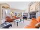 Spacious living room with a stone fireplace and comfortable seating at 127 Sands Point Dr, Tierra Verde, FL 33715