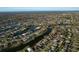 Aerial view of a residential area near the ocean at 1290 Cambridge Dr, Venice, FL 34293