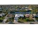 Aerial view of neighborhood and canal at 1290 Cambridge Dr, Venice, FL 34293