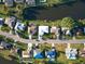 Aerial view of neighborhood and canal at 1290 Cambridge Dr, Venice, FL 34293