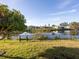 Spacious backyard with canal view and lush lawn at 1290 Cambridge Dr, Venice, FL 34293