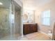 Spa-like bathroom with double vanity and large shower at 1290 Cambridge Dr, Venice, FL 34293