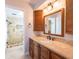 Updated bathroom with a new vanity, tile flooring and walk-in shower at 1290 Cambridge Dr, Venice, FL 34293