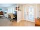 Bright entryway with built-in workspace and glass door at 1290 Cambridge Dr, Venice, FL 34293