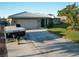 Single-story home with attached garage and RV parking at 1290 Cambridge Dr, Venice, FL 34293