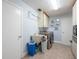 Convenient laundry room with washer, dryer, and utility sink at 1290 Cambridge Dr, Venice, FL 34293