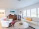 Living room featuring a comfy couch and a round coffee table at 1290 Cambridge Dr, Venice, FL 34293