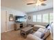 Living area with sectional sofa and built-in shelving at 1290 Cambridge Dr, Venice, FL 34293