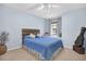 Bedroom with a queen bed and window seat at 1307 Timber Trace Dr, Wesley Chapel, FL 33543