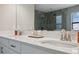 Elegant bathroom with double vanity and large mirror reflecting the shower at 14786 Horse Trot Rd, Lithia, FL 33547