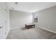Simple bedroom with gray carpeting and a coffee table at 14786 Horse Trot Rd, Lithia, FL 33547