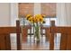 Rustic wooden dining table with sunflowers as centerpiece at 14786 Horse Trot Rd, Lithia, FL 33547