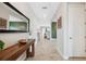Spacious entryway with tile floors, a console table, and mirror at 14786 Horse Trot Rd, Lithia, FL 33547