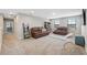 Large game room with leather sofas and a view of the hallway at 14786 Horse Trot Rd, Lithia, FL 33547