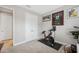 Bright home office features Peloton bike, built-in desk, and ample natural light at 14786 Horse Trot Rd, Lithia, FL 33547