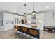 Modern kitchen with white cabinets, quartz countertops, and island at 14786 Horse Trot Rd, Lithia, FL 33547