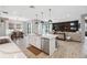 Open concept kitchen with island, dining area, and living room view at 14786 Horse Trot Rd, Lithia, FL 33547