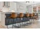 Kitchen boasts a large island with seating for four and quartz countertops at 14786 Horse Trot Rd, Lithia, FL 33547