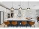 Modern kitchen with white cabinets, stainless steel appliances, and a large island at 14786 Horse Trot Rd, Lithia, FL 33547
