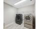 Bright laundry room, featuring a washer and dryer at 14786 Horse Trot Rd, Lithia, FL 33547