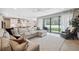 Bright and airy living area with large sectional sofa and access to patio at 14786 Horse Trot Rd, Lithia, FL 33547