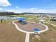 Community playground with swings and slides at 14786 Horse Trot Rd, Lithia, FL 33547