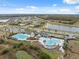 Community pool with lounge chairs at 14786 Horse Trot Rd, Lithia, FL 33547
