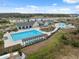 Community pool with lap lanes, a leisure pool, and lounge area at 14786 Horse Trot Rd, Lithia, FL 33547