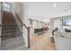 Open staircase leading to upper level and overlooking kitchen and living area at 14786 Horse Trot Rd, Lithia, FL 33547