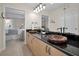 Bathroom with double sinks, granite counters, and a view of bedroom at 1600 Gulf Blvd # 417, Clearwater Beach, FL 33767