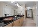 Elegant bathroom with double sinks and wood vanity at 1600 Gulf Blvd # 417, Clearwater Beach, FL 33767