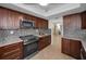 Modern kitchen with stainless steel appliances and ample counter space at 1600 Gulf Blvd # 417, Clearwater Beach, FL 33767