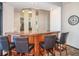 Community wet bar with wood cabinetry and four leather stools at 1600 Gulf Blvd # 417, Clearwater Beach, FL 33767