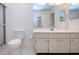 Bathroom with toilet and vanity at 1613 Faxton Dr, Sun City Center, FL 33573