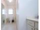 Bathroom with toilet, shower, and vanity at 1613 Faxton Dr, Sun City Center, FL 33573