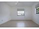 Bright bedroom with tile flooring, large closet, and window at 1613 Faxton Dr, Sun City Center, FL 33573