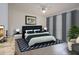 Spacious bedroom with a large bed and ensuite bathroom at 1613 Faxton Dr, Sun City Center, FL 33573