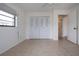Spacious bedroom with tile floors and double door closet at 1613 Faxton Dr, Sun City Center, FL 33573