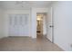Bedroom with view of bathroom and double door closet at 1613 Faxton Dr, Sun City Center, FL 33573