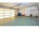 Spacious garage with storage cabinets and door at 1613 Faxton Dr, Sun City Center, FL 33573