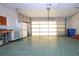 Garage with ample storage and automatic door at 1613 Faxton Dr, Sun City Center, FL 33573