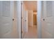 Hallway with access to bathroom and closets at 1613 Faxton Dr, Sun City Center, FL 33573