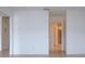 Clean hallway with doors to bathroom and other rooms at 1613 Faxton Dr, Sun City Center, FL 33573