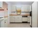 Kitchen boasts ample counter space and white cabinetry at 1613 Faxton Dr, Sun City Center, FL 33573