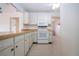 Kitchen with light-colored cabinets and modern appliances at 1613 Faxton Dr, Sun City Center, FL 33573