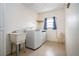 Laundry room includes washer, dryer, and utility sink at 1613 Faxton Dr, Sun City Center, FL 33573