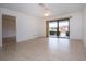 Spacious living room featuring tile floors and access to another room at 1613 Faxton Dr, Sun City Center, FL 33573