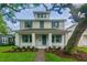 Two-story house with gray shutters and a landscaped front yard at 1742 W Saint Louis St, Tampa, FL 33607