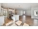 Open concept kitchen and living area with hardwood floors at 1742 W Saint Louis St, Tampa, FL 33607